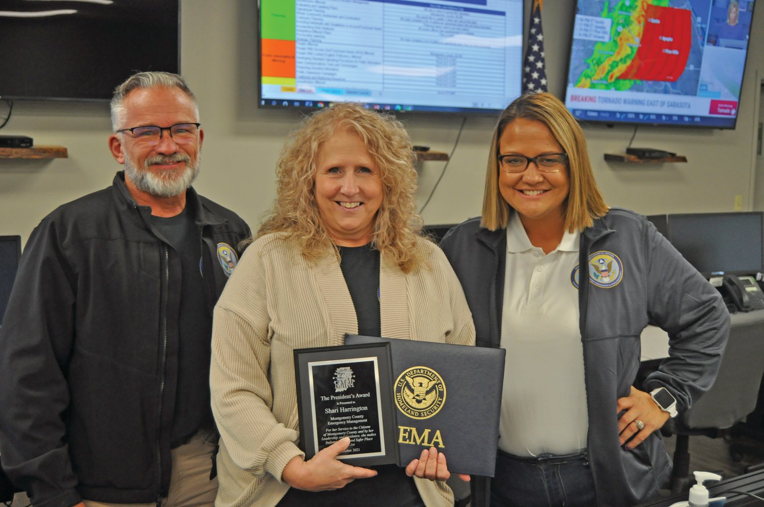 Montgomery County Emergency Management and Homeland Security Agency Director Shari Harrington, center, was recently recognized in 2021 by the Emergency Management Alliance of Indiana. She has worked for the county for 20 years and has resigned to take a position with the state emergency manage system.